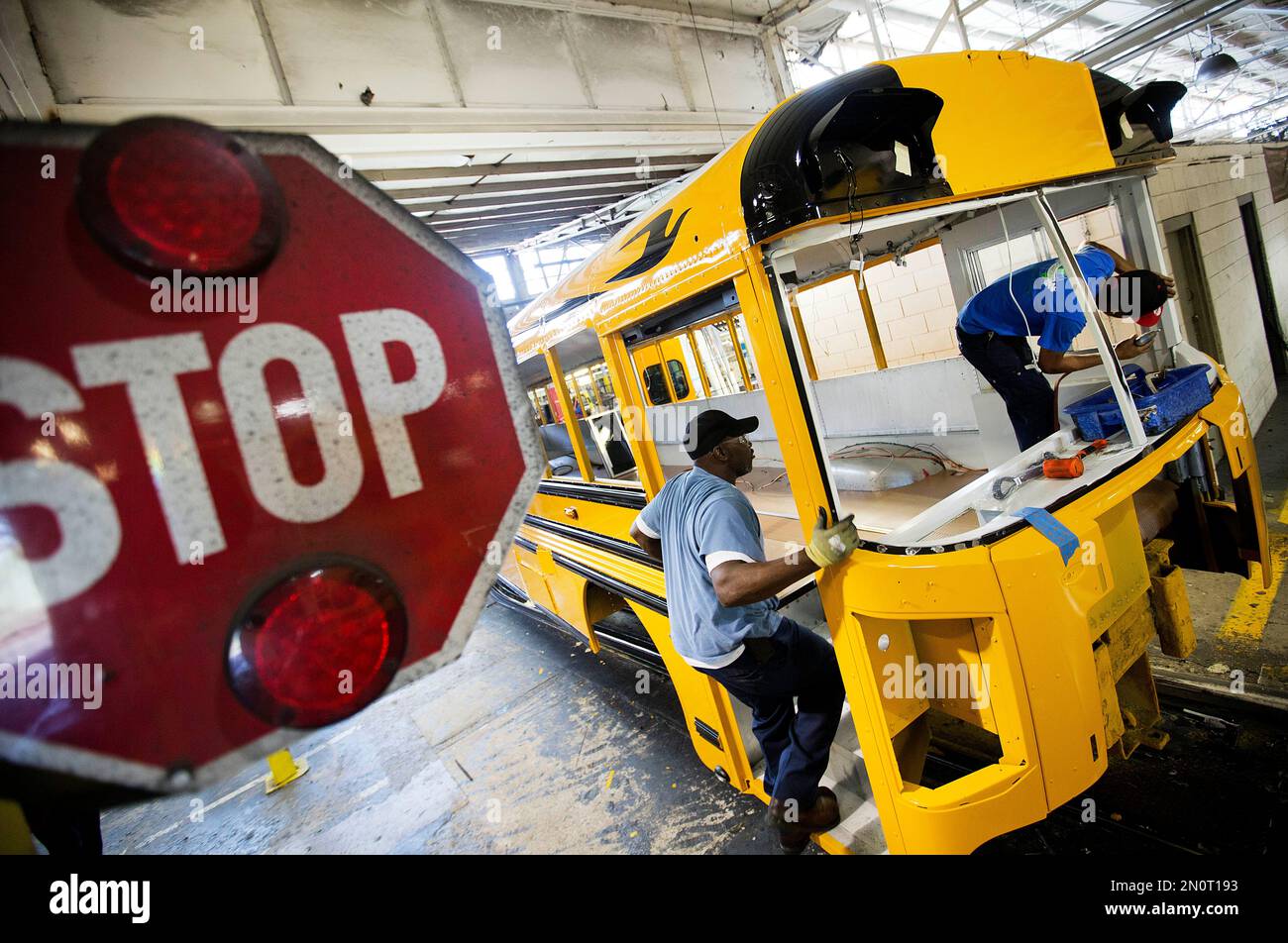 https://c8.alamy.com/comp/2N0T193/for-use-as-desired-in-this-sept-18-2015-photo-employees-work-on-a-school-bus-on-the-assembly-line-at-blue-bird-corporations-manufacturing-facility-in-fort-valley-ga-blue-bird-corporation-one-of-the-nations-leading-manufacturer-of-school-buses-employees-about-1600-workers-and-has-sold-more-than-550000-buses-since-its-formation-in-1927-ap-photodavid-goldman-2N0T193.jpg