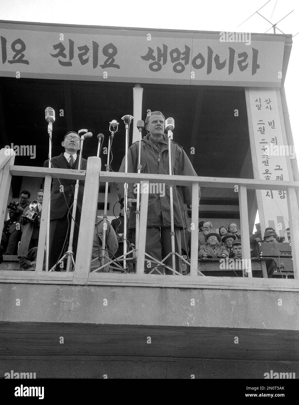 American evangelist Billy Graham addresses a crowd of 30,000 in Seoul Stadium, South Korea, Feb