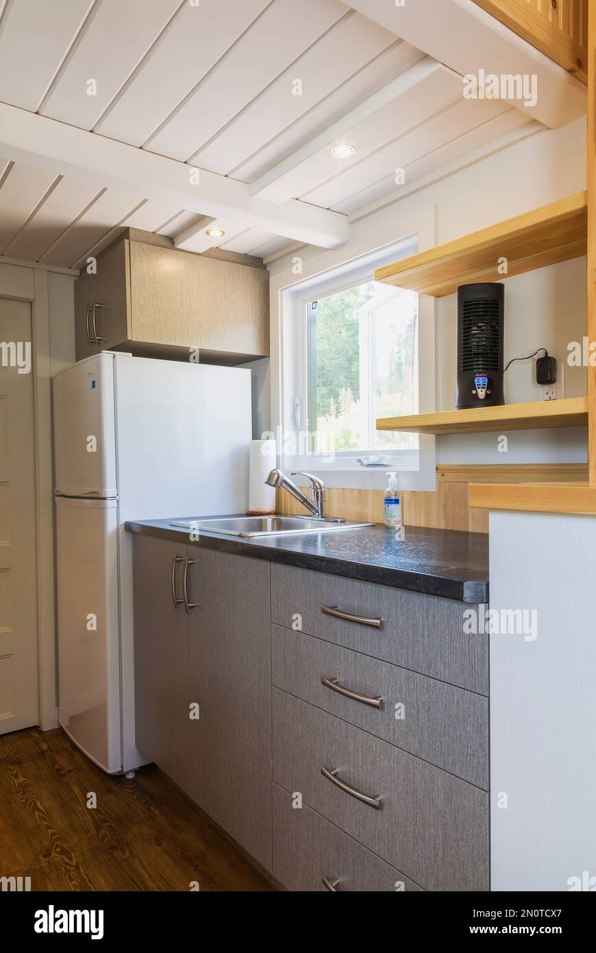 Black arborite kitchen countertop with grey and white melamine