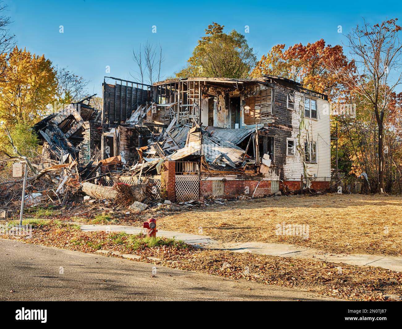 A house is partially destroyed and gutted after arsonists burned the main building. Stock Photo