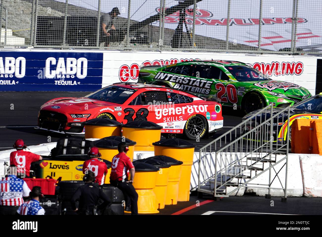 NASCAR Cup Series driver Christopher Bell (20), right, spins out as driver Todd Gilliland (38) passes by during the qualifying portion of the Busch Light Clash NASCAR exhibition auto race at Los