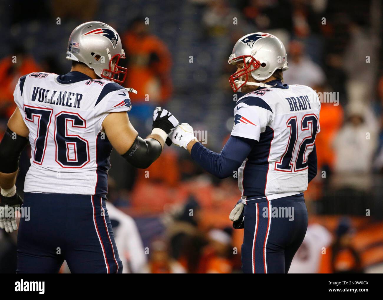 Tom Brady (12) of the New England Patriots throws a pass during the AFC  Championship game at Sports Authority Field at Mile High in Denver on  January 19, 2014. The New England-Denver