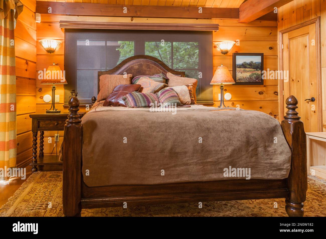 Antique queen size four poster bed and nightstand in master bedroom inside  milled cottage style flat log profile home, Quebec, Canada. This image is p  Stock Photo - Alamy