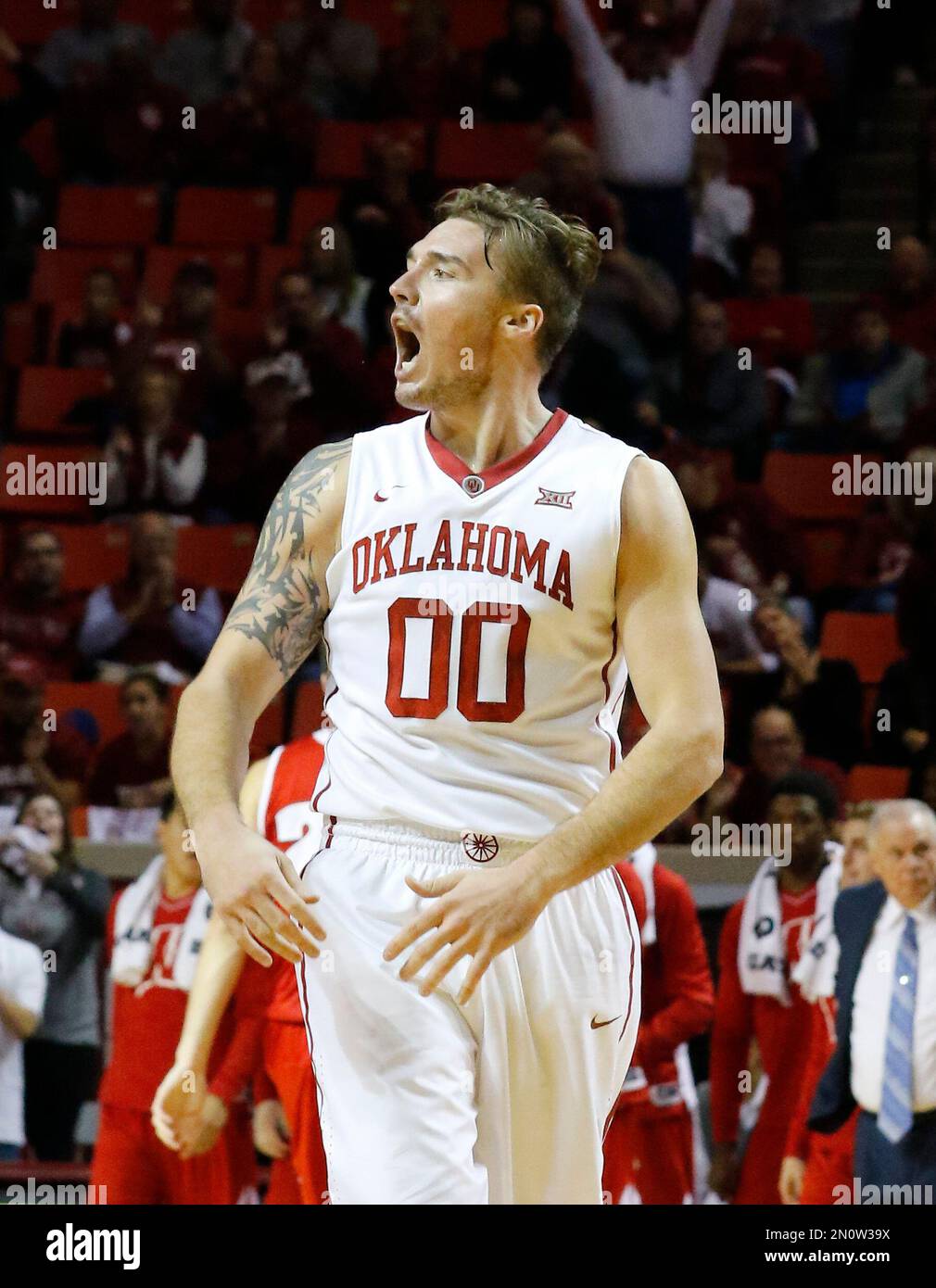 Oklahoma forward Ryan Spangler (00) reacts after his team scored against Wisconsin during the first half of an NCAA college basketball game in Norman, Okla., Sunday, Nov