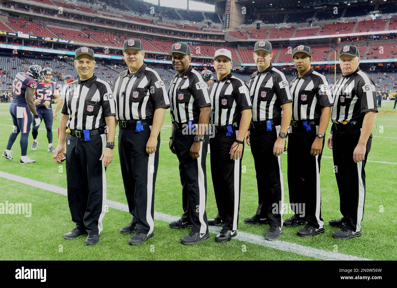 Officials pose for a photo before an NFL football game between the Atlanta  Falcons and the Chicago Bears, Sunday, Nov. 20, 2022, in Atlanta. Officials  are from left, Replay official Andrew Lambert