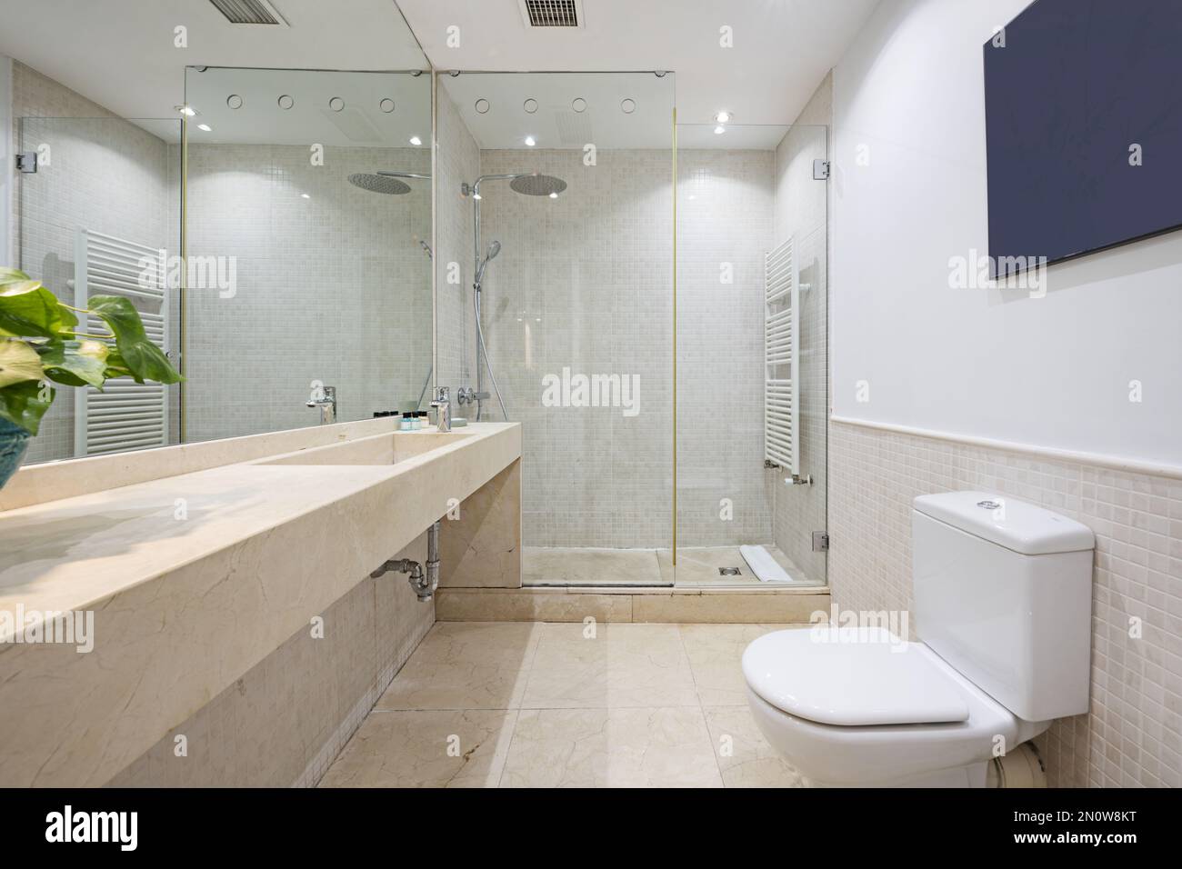 Bathroom without with a mirror covering the wall, a shower