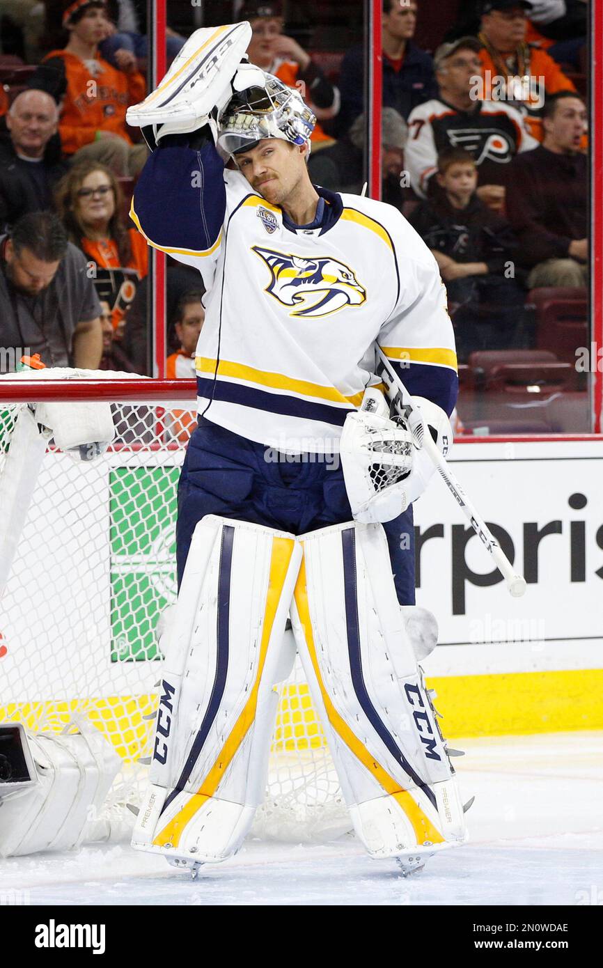 Nashville Predators' Pekka Rinne of Finland looks on with his mask
