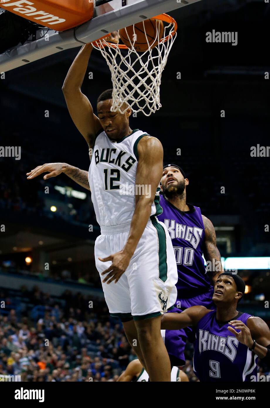 Milwaukee Bucks' Jabari Parker (12) dunks past Sacramento Kings' Willie ...