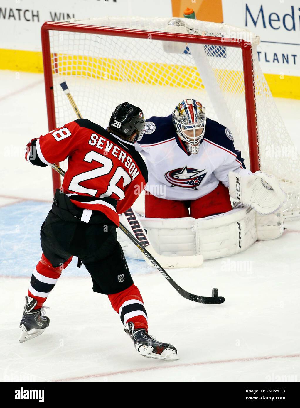 New Jersey Devils defenseman Damon Severson (28) attacks the net of ...