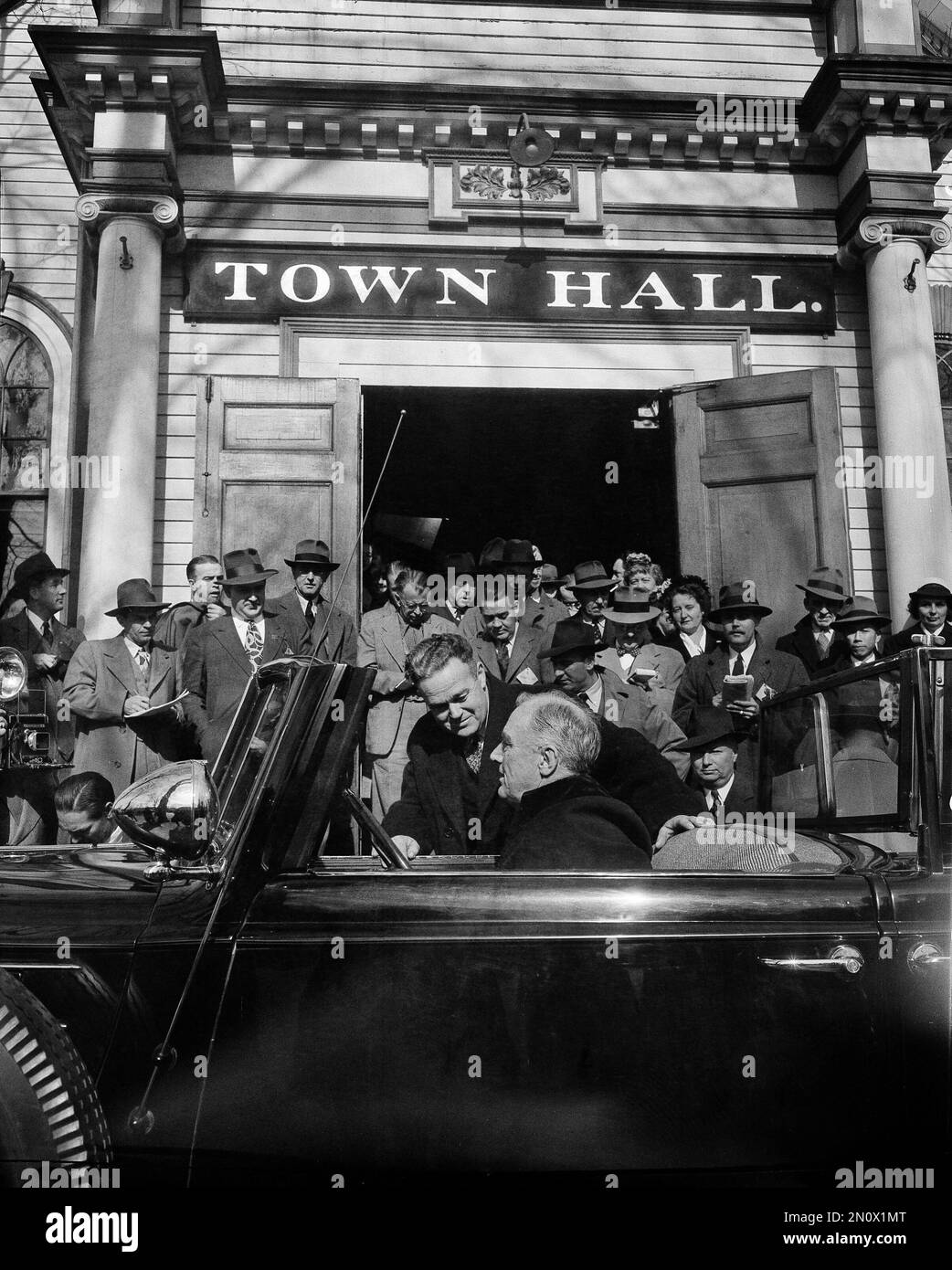 President Franklin D. Roosevelt, seated in car, chats with Elmer van