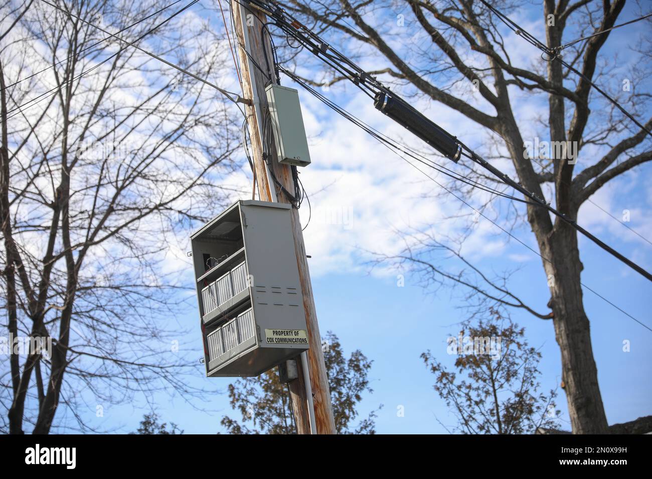 Electric power lines in the clear blue sky Stock Photo - Alamy