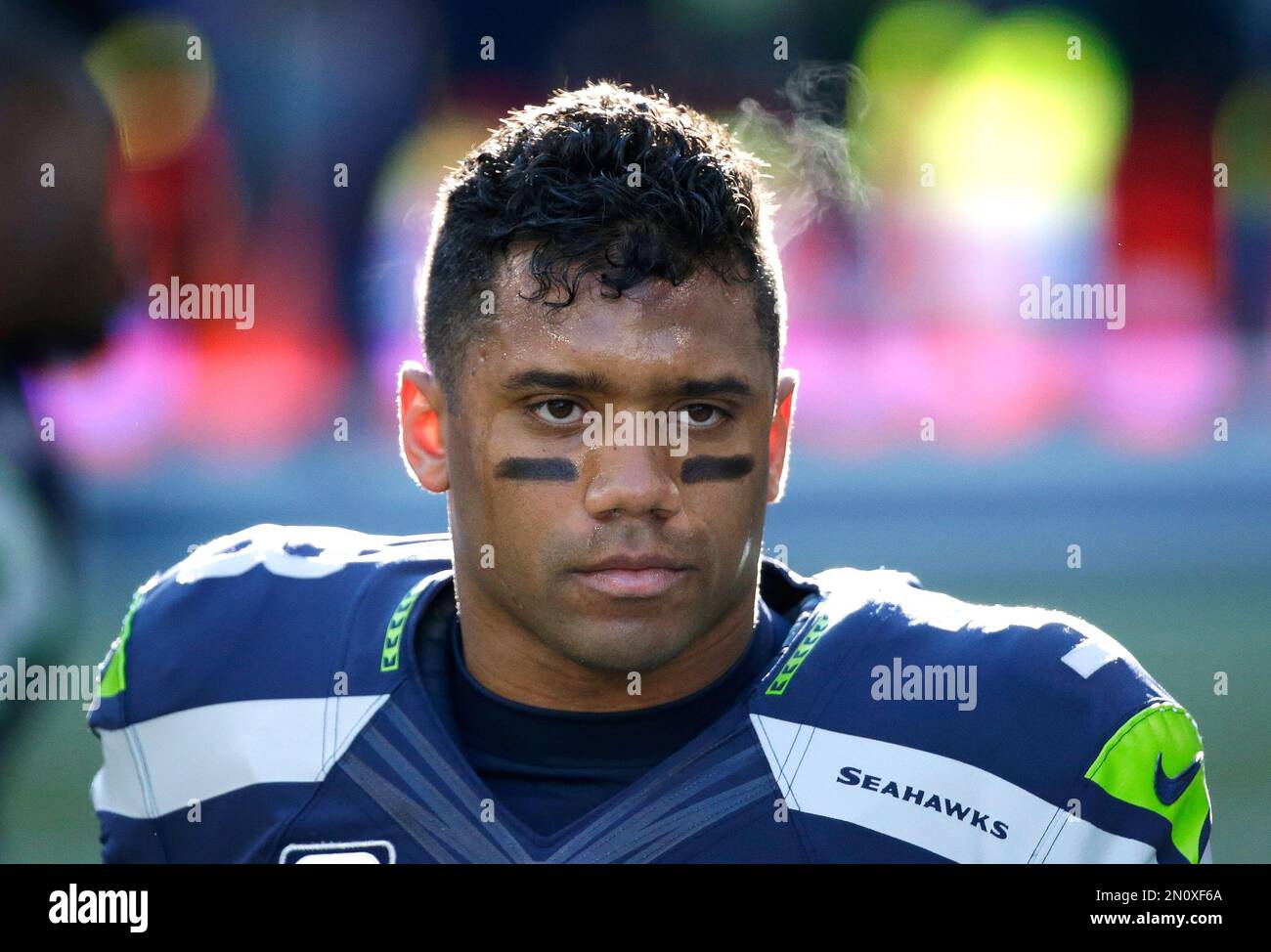 Steam rises from the head of Seattle Seahawks quarterback Russell Wilson as  he stretches during warmups before an NFL football game against the San  Francisco 49ers, Sunday, Nov. 22, 2015, in Seattle. (