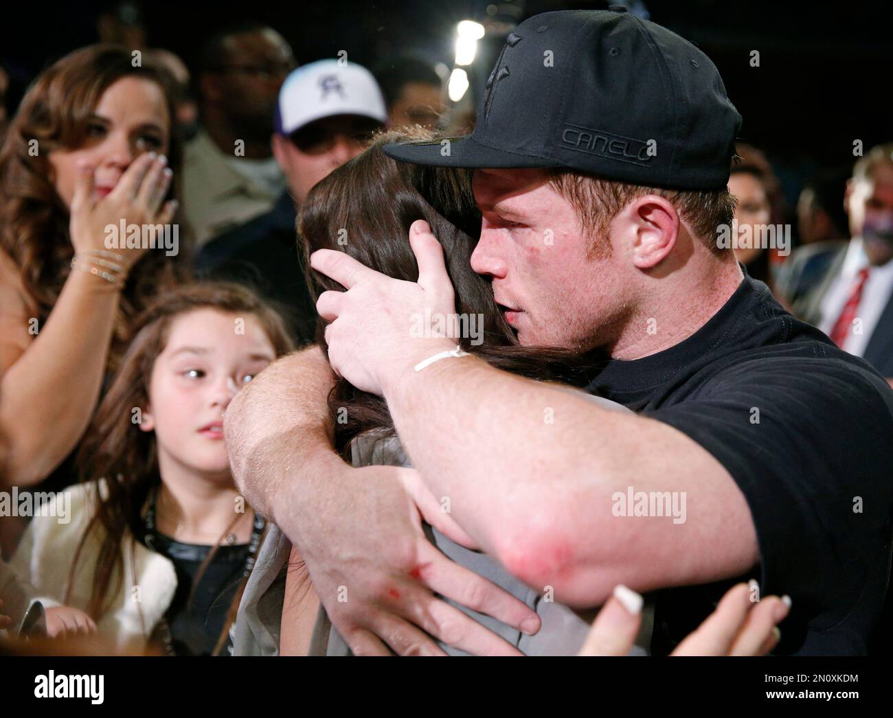 Canelo Alvarez, of Mexico, hugs girlfriend Nelda Sepulveda after