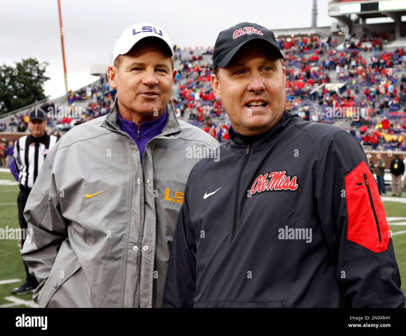 LSU head coach Les Miles, left, confers with Mississippi head coach