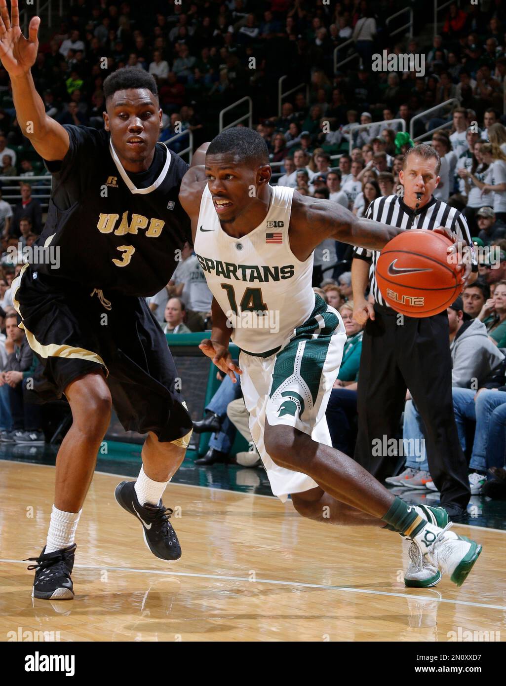Michigan State's Eron Harris, right, drives against ArkansasPine Bluff