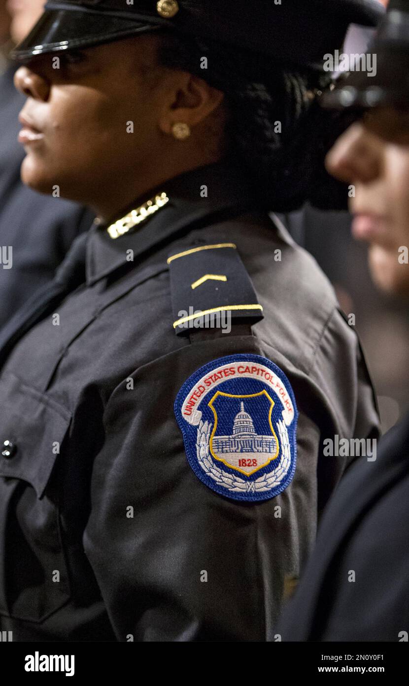 The newest members of the U.S. Capitol Police stand during their ...