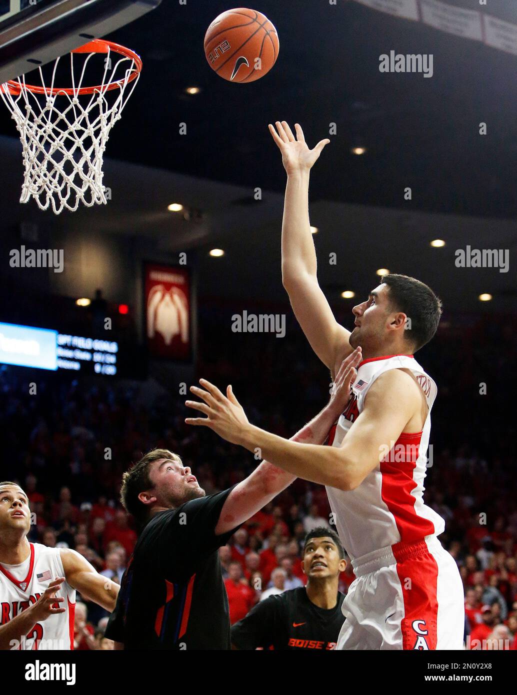 Arizona center Dusan Ristic, right, shoots over Boise State forward