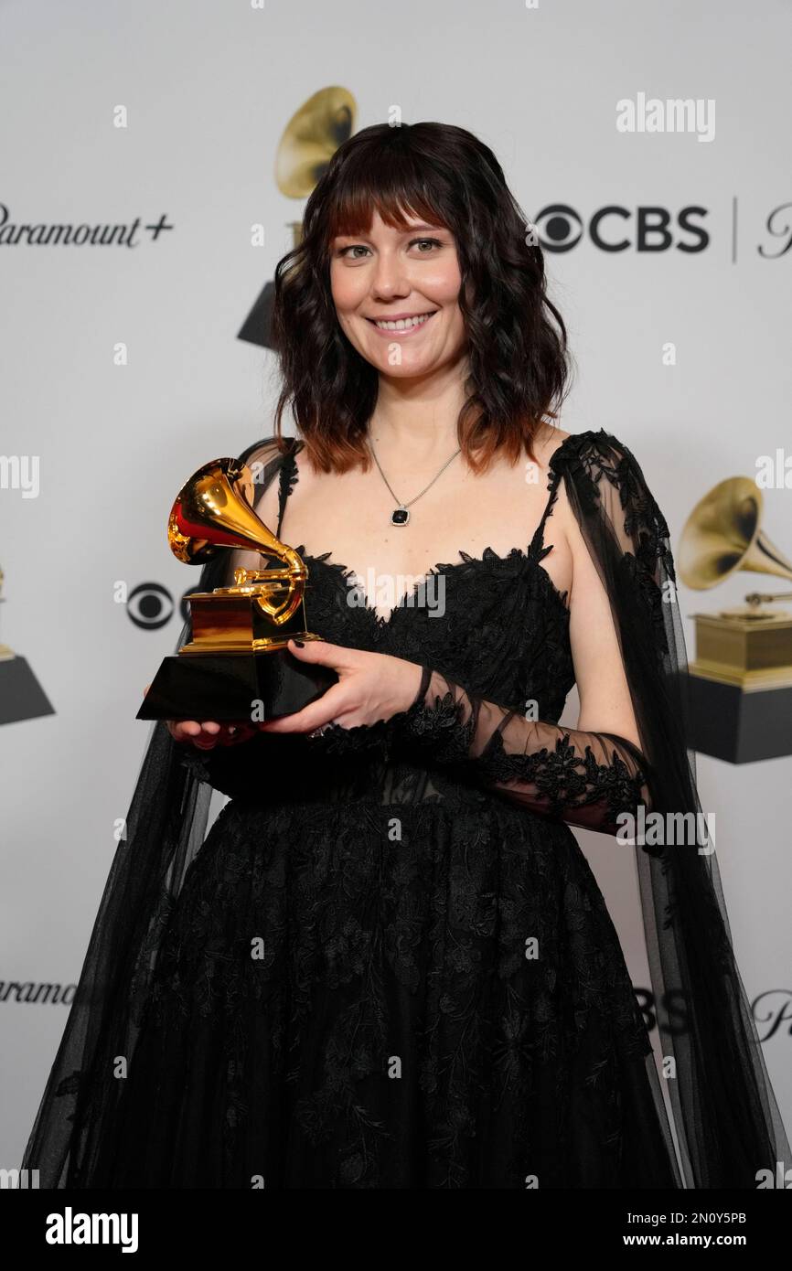 Molly Tuttle poses in the press room with the award for best bluegrass album for "Crooked Tree