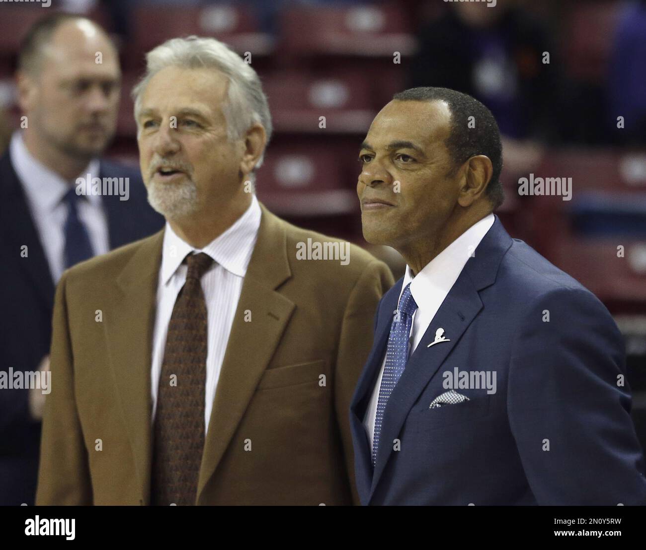Brooklyn Nets head coach Lionel Hollins, right and assistant coach Paul ...