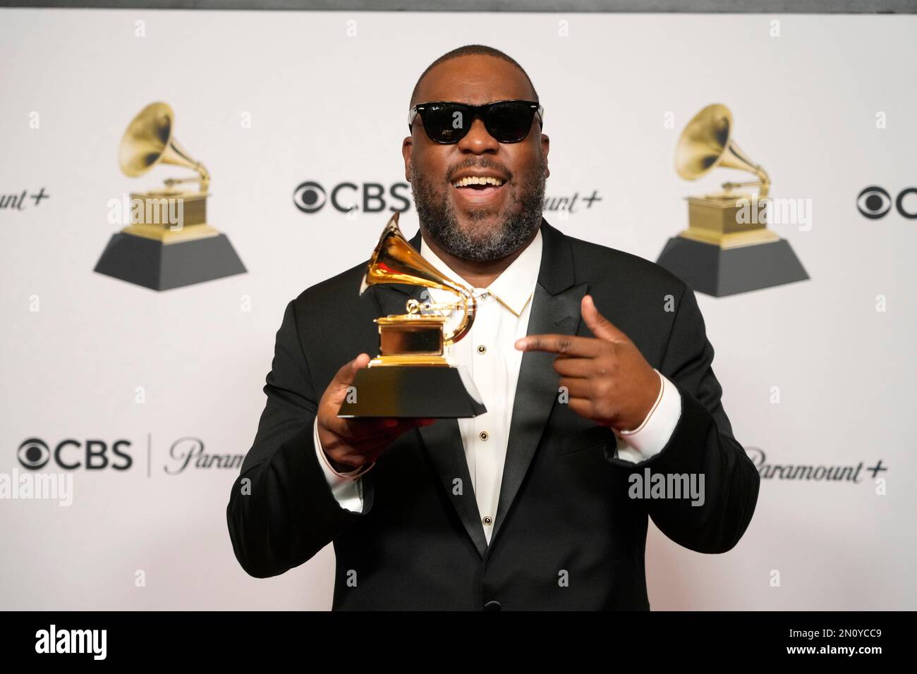 Robert Glasper poses in the press room with the award for best R&B