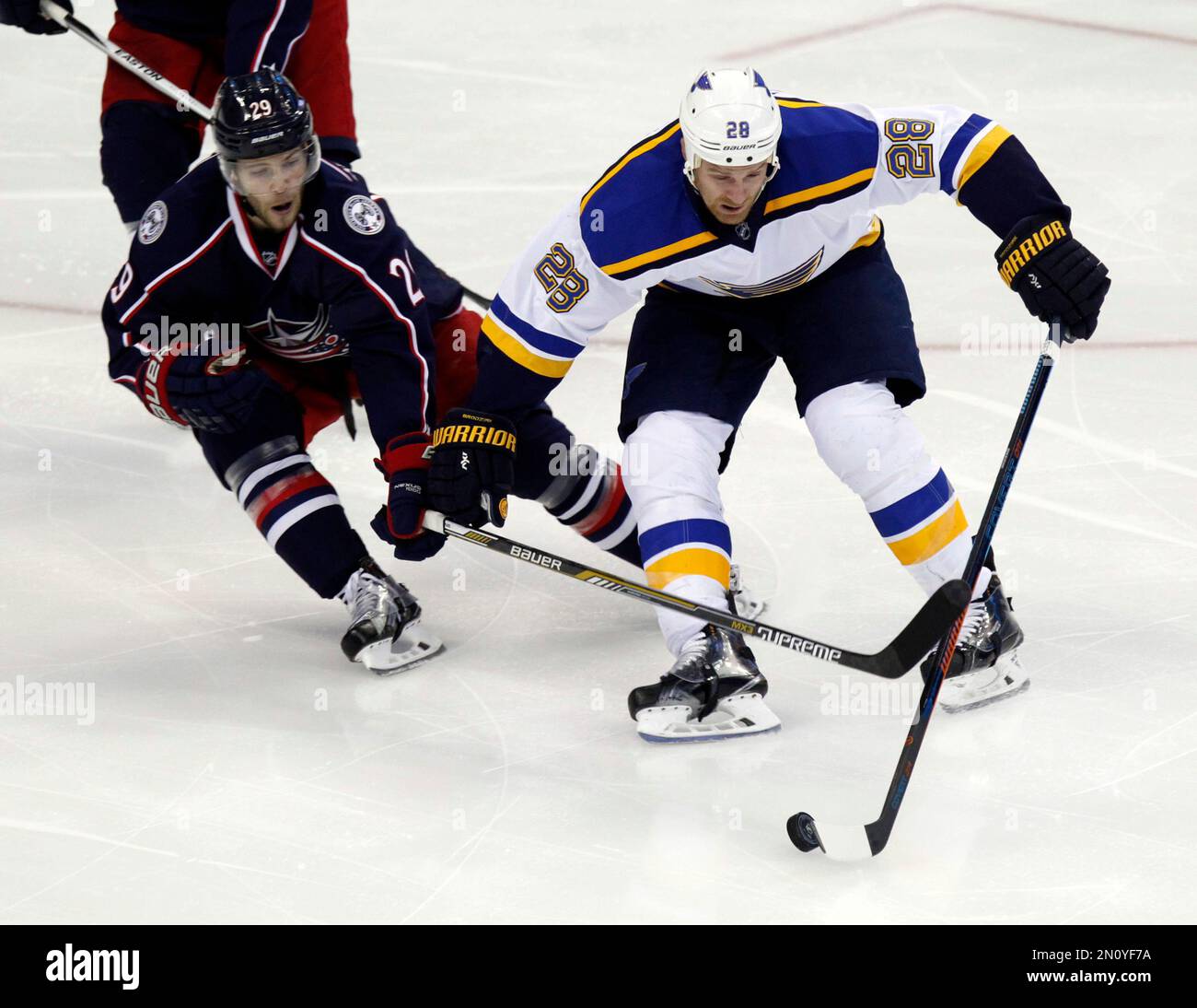 St. Louis BLues' Kyle Brodziak, right, works for the puck against ...