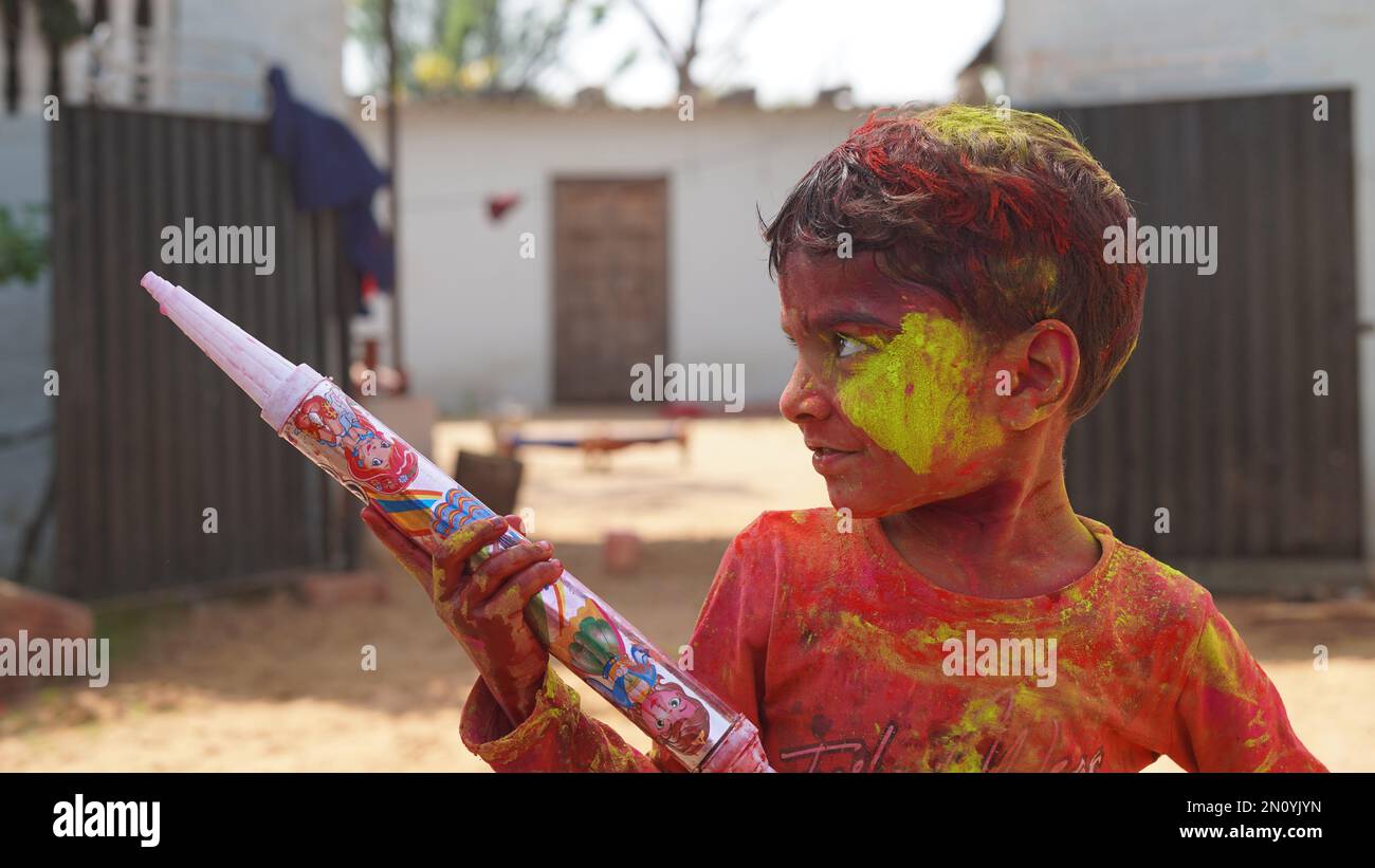 Cute indian little child playing holi. Holi is colors festival in india Stock Photo