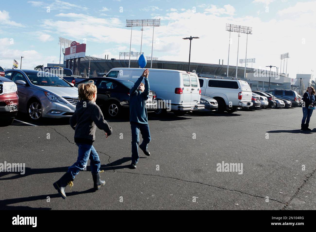 Kids play football while tailgating at O.co Coliseum before an NFL