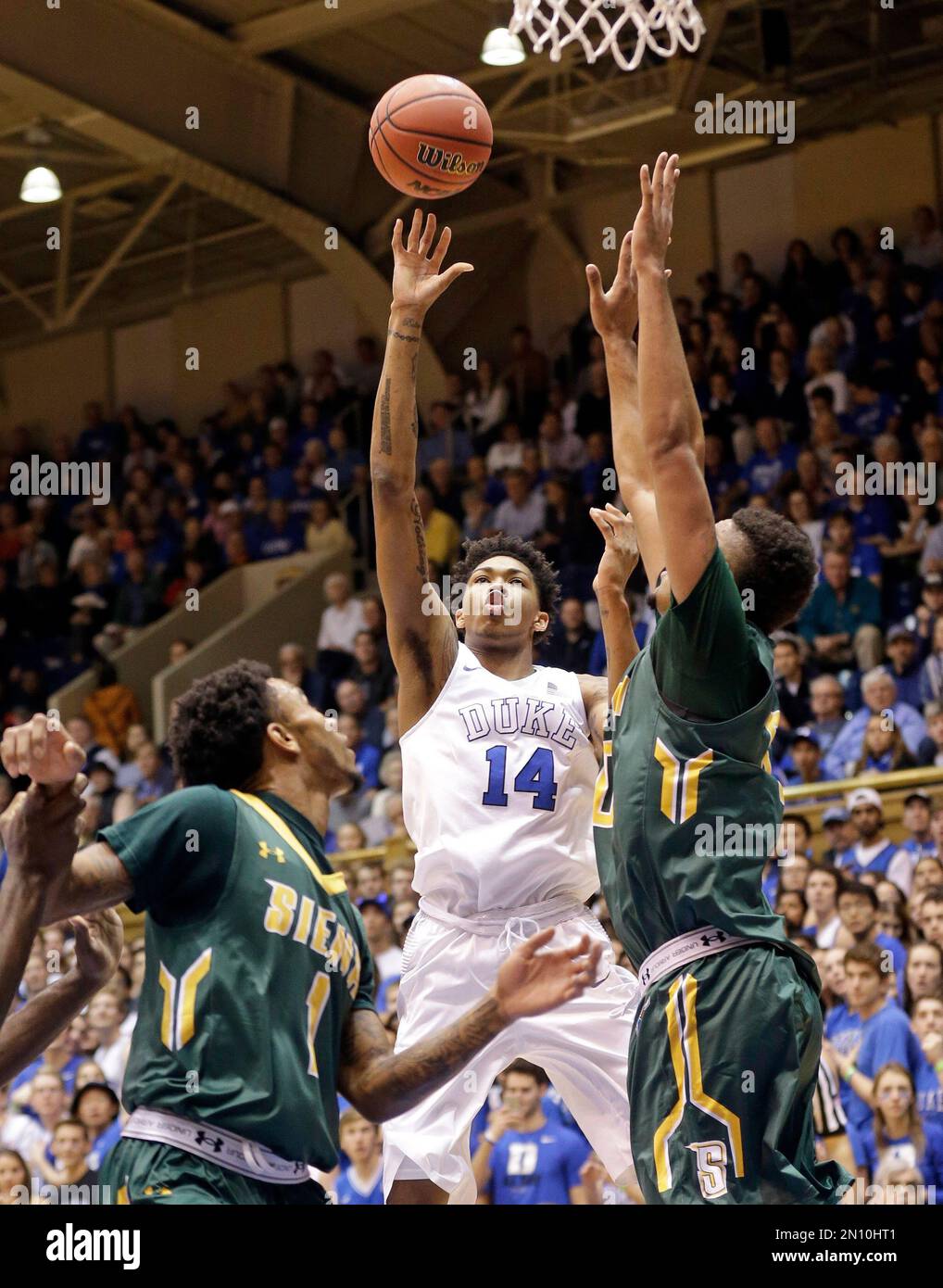 Duke's Brandon Ingram (14) drives to the basket as Siena's Marquis ...