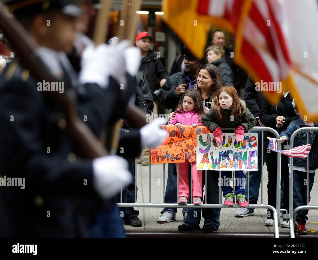 Sophie, 8, right, and her sister, Ruby O'Hara hold signs as they watch ...