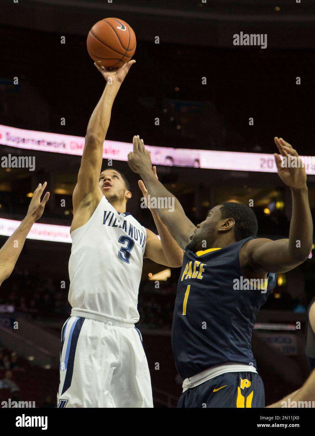 Villanova's Josh Hart (3) shoots past Pace's Austin Mofunanya in the