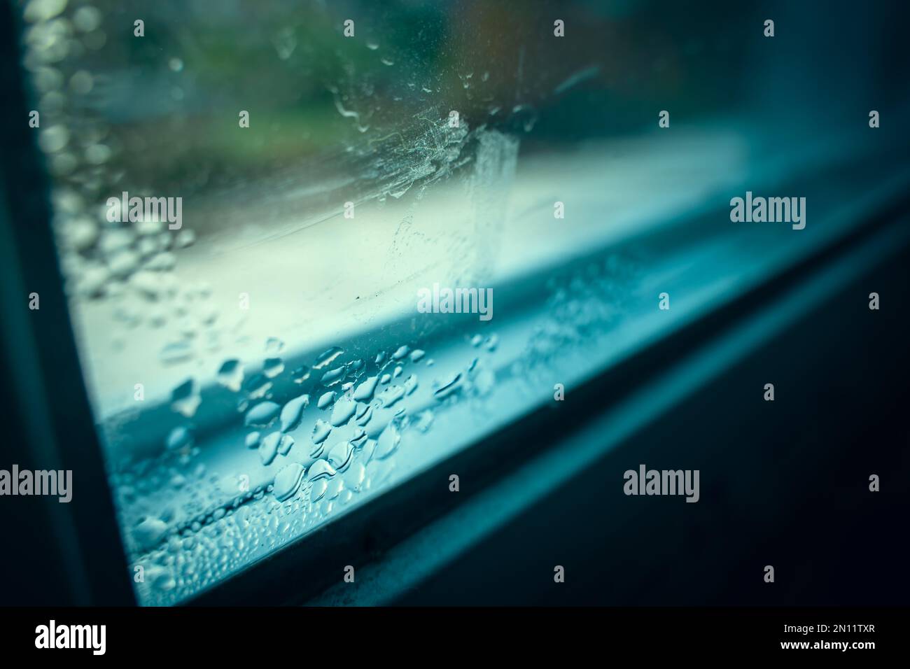 Drops of condensation on the window close-up. Humidity and temperature difference between the street and the room Stock Photo