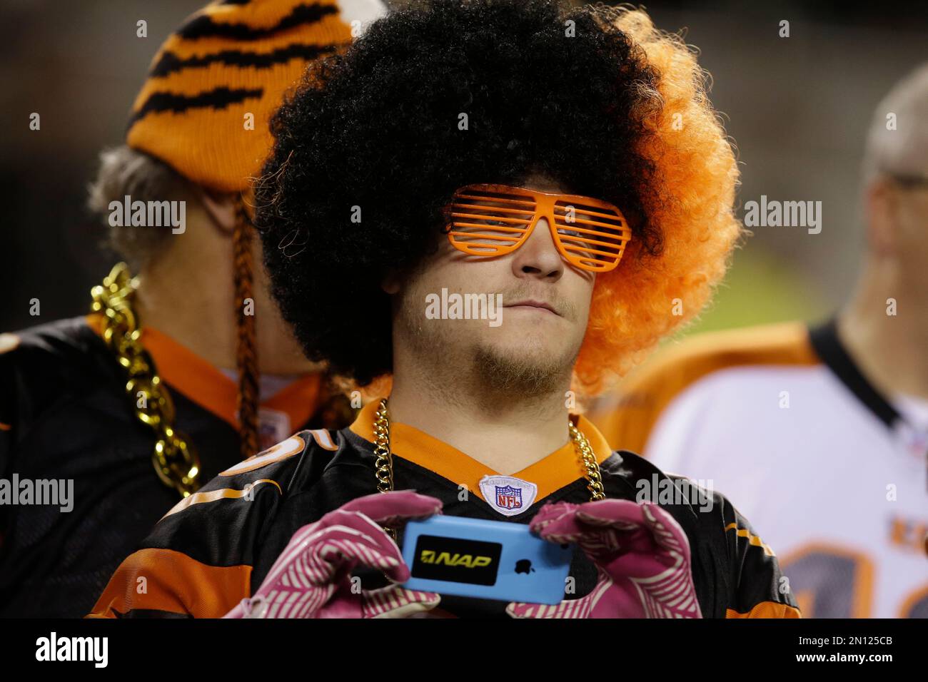 A Cincinnati Bengals fan wears a black and orange afro wig before an NFL football game against the Cleveland Browns Thursday Nov. 5 2015 in Cincinnati. AP Photo Darron Cummings Stock Photo Alamy
