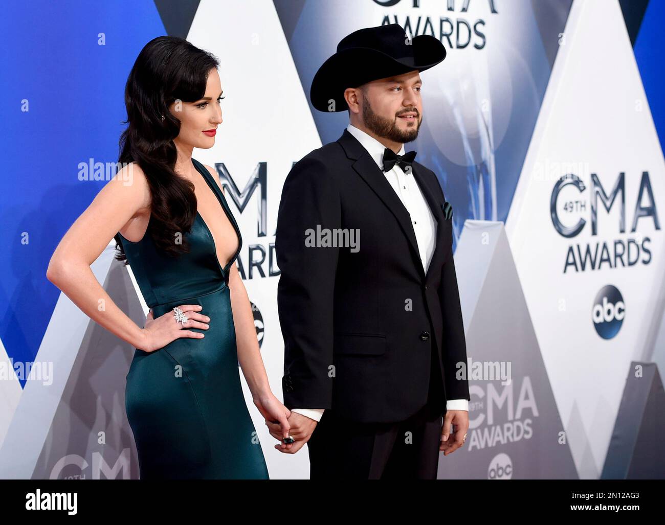 Kacey Musgraves, left, and Misa Arriaga arrive at the 49th annual CMA