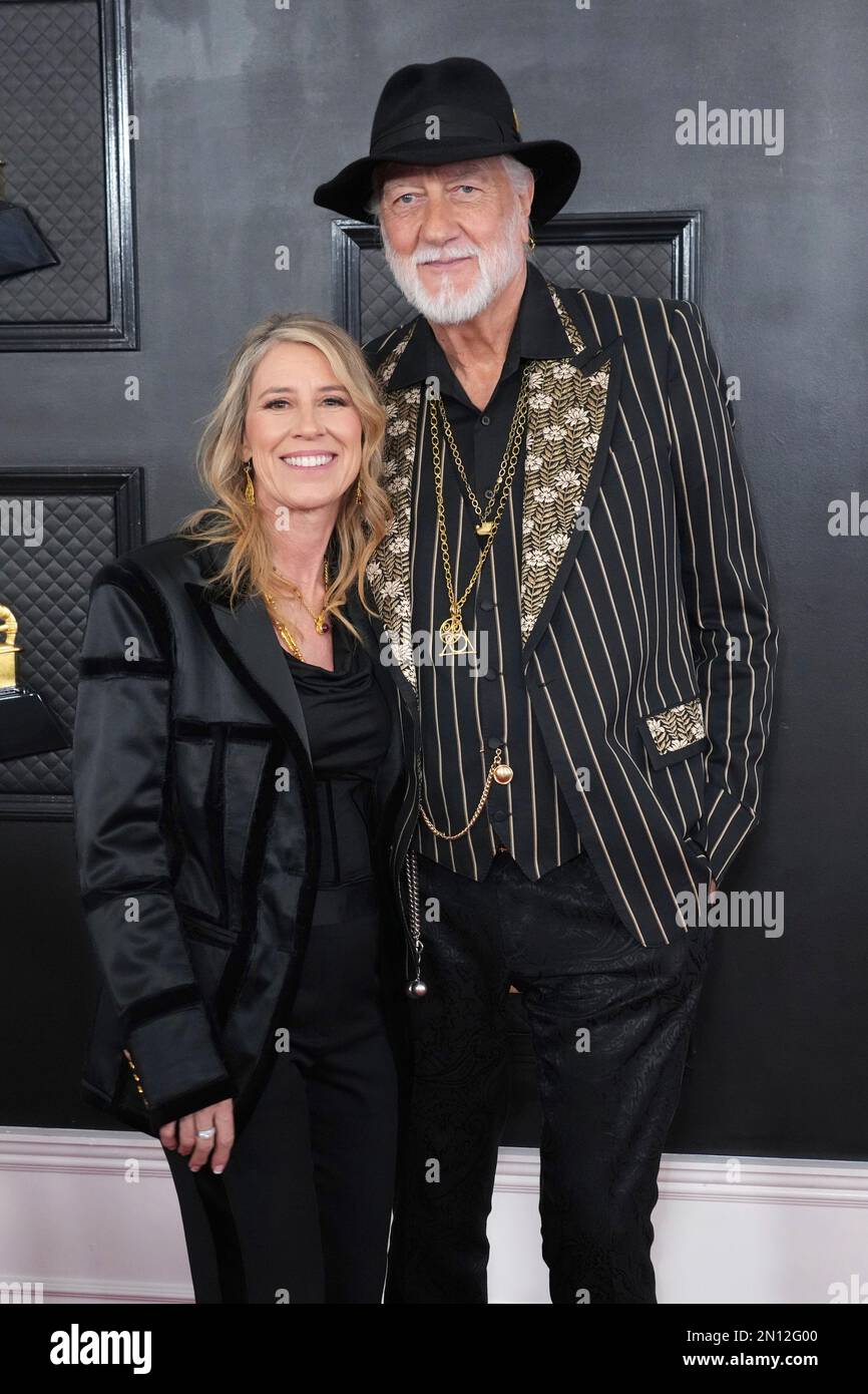 Elizabeth Jordan, left, and Mick Fleetwood arrive at the 65th annual
