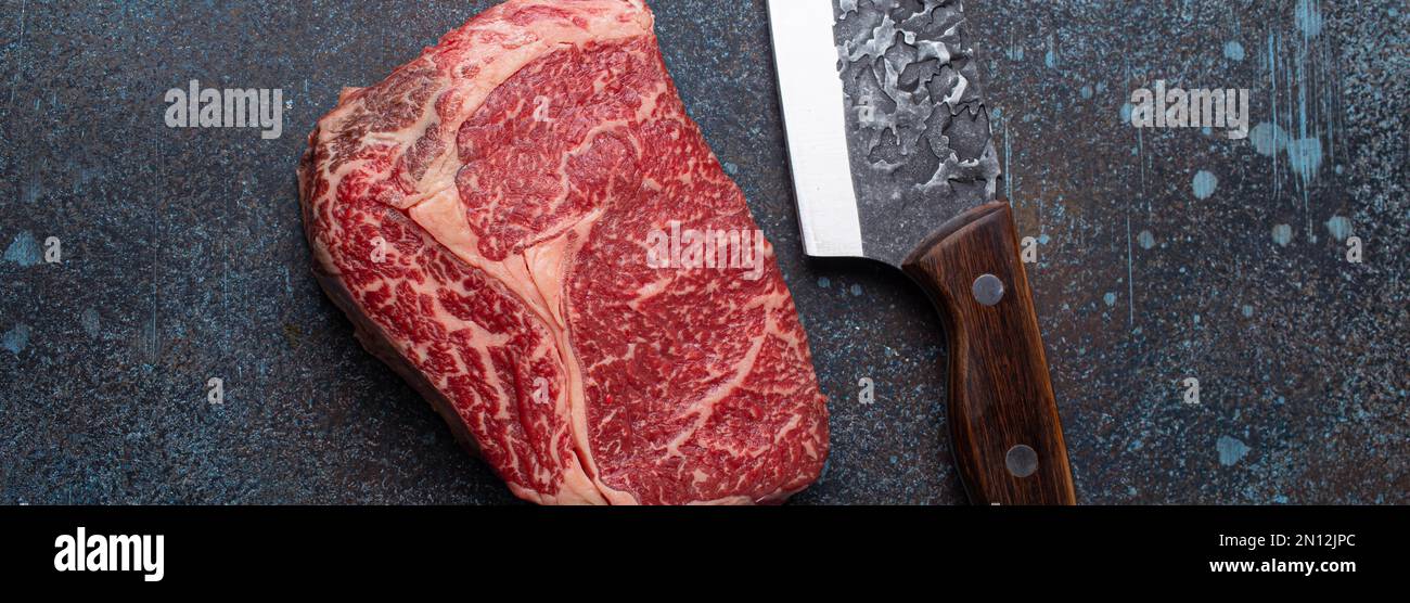 Raw fresh uncooked meat beef prime cut steak Ribeye on clean red ...