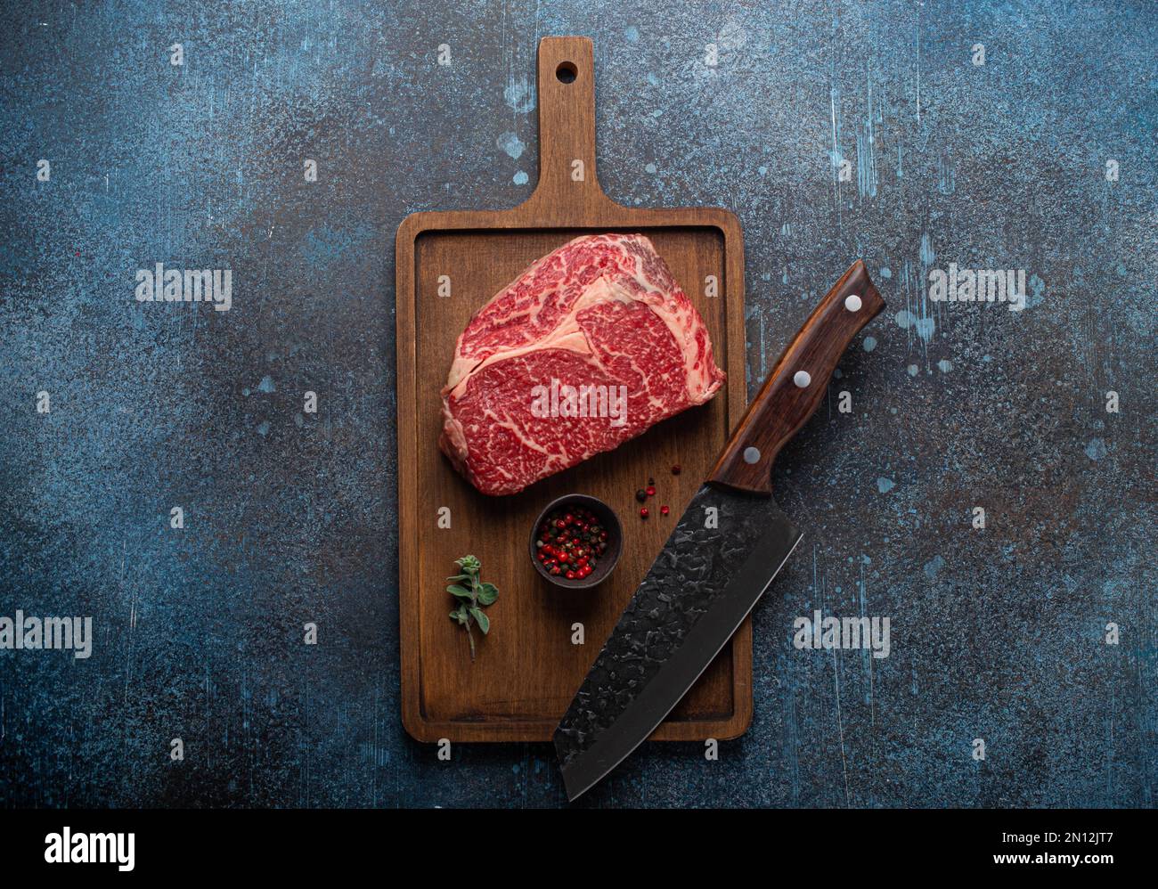 Raw meat beef marbled prime cut steak Ribeye on wooden cutting board ...