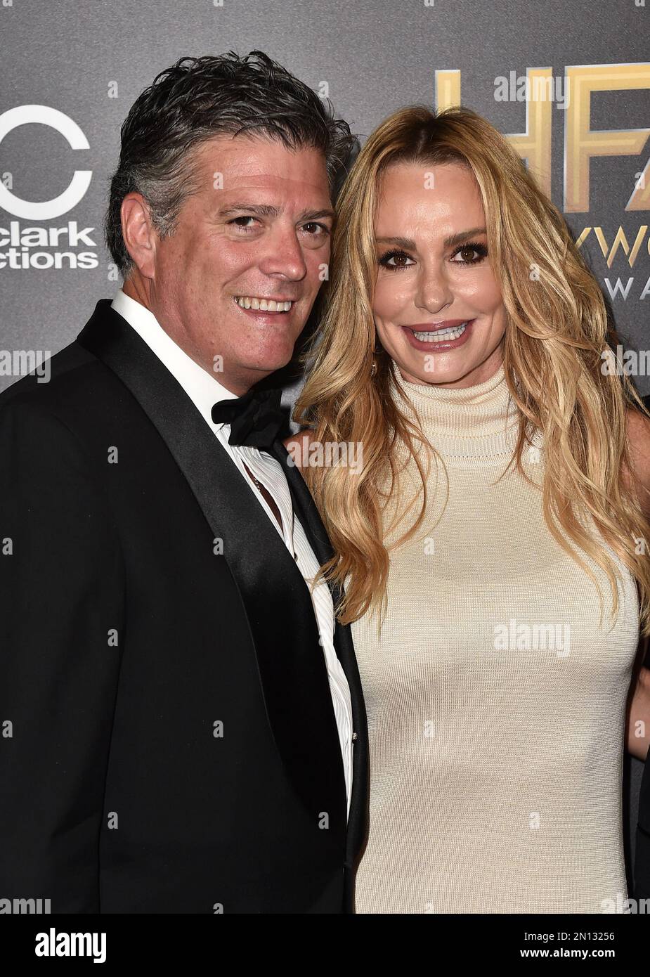John H Bluher, left, and Taylor Armstrong arrive at the Hollywood Film
