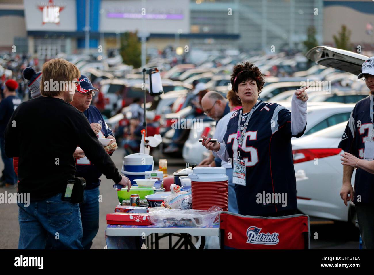 Fans spend time tailgating in the parking lot of Gillette Stadium