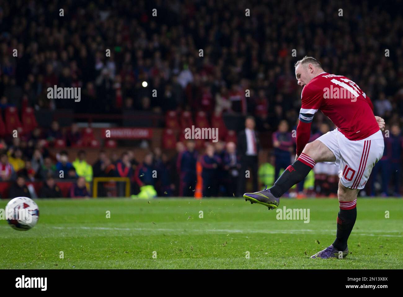 In this picture taken on Wednesday Oct. 28, 2015, Manchester United's Wayne  Rooney takes a penalty during the English League Cup soccer match berween Manchester  United and Middlesbrough at Old Trafford Stadium,