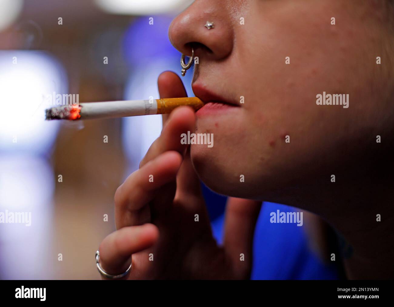 In this July 17, 2015 photo, store manager Stephanie Hunt smokes a
