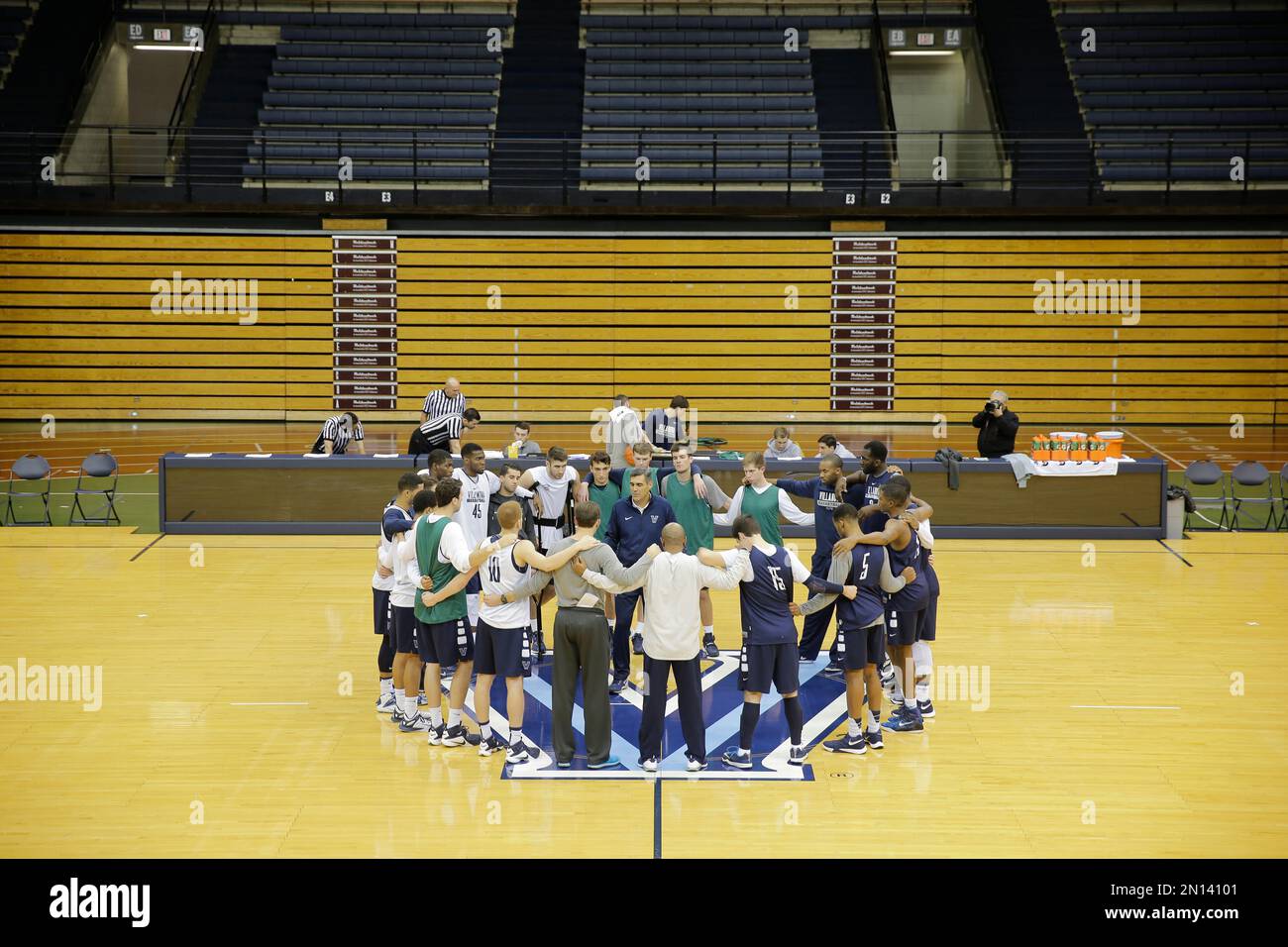 Villanova head coach Jay Wright speaks with his players during the NCAA