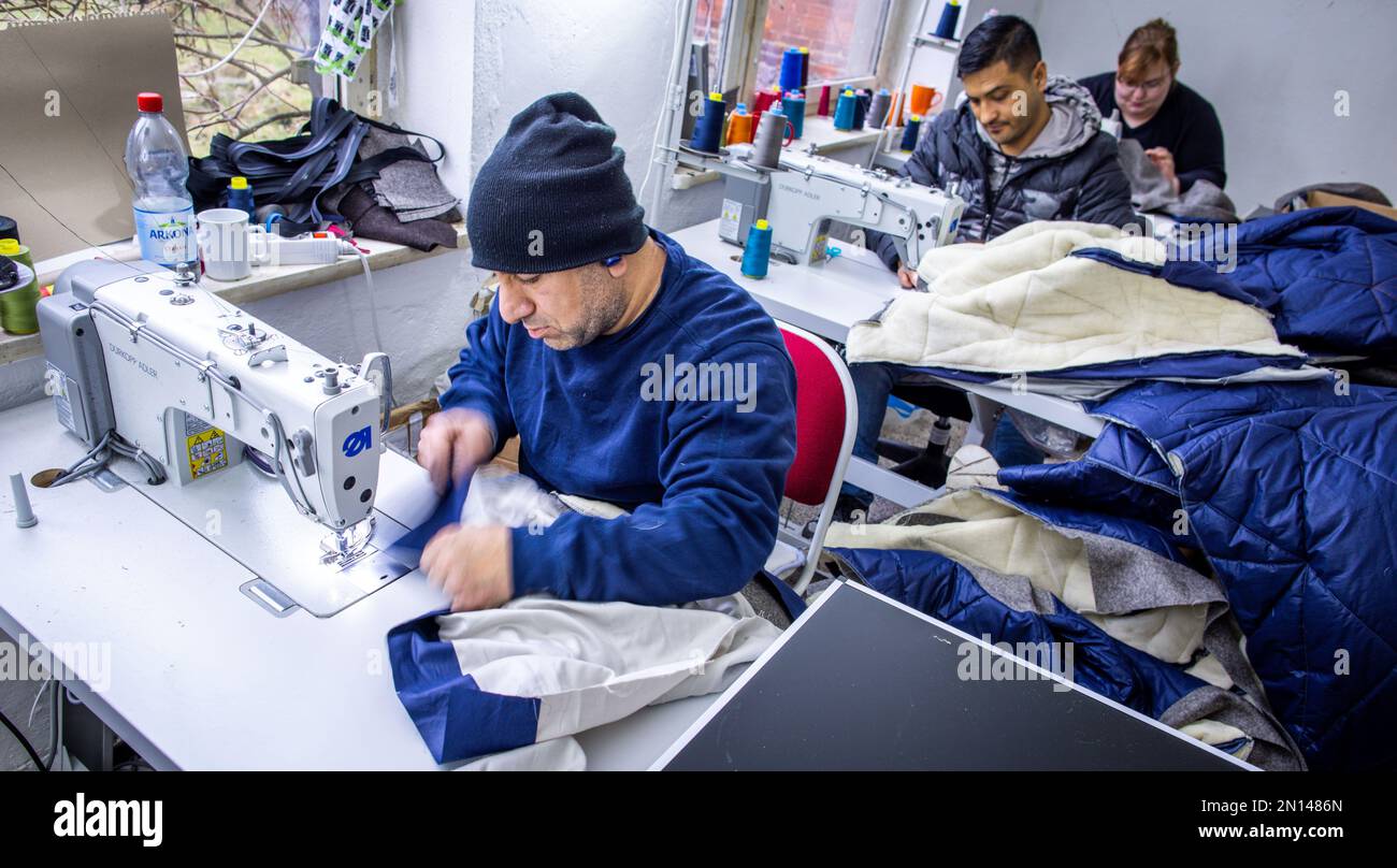 Teplitz, Germany. 26th Jan, 2023. Jackets from a collection of the company Nordwolle are sewn by Jaweecsh Abdolkader (front) and Ali Ramanan in the sewing room. In the future, a fieldstone barn that is currently being expanded will house the production of sustainable functional clothing made from wool from Pomeranian sheep. In 2018, Scheel moved his company, which he had founded two years earlier on the island of Rügen, to Teplitz and had become known in the media for his fight against the authorities for necessary building permits. (to dpa 'Chic from the la Credit: dpa/Alamy Live News Stock Photo