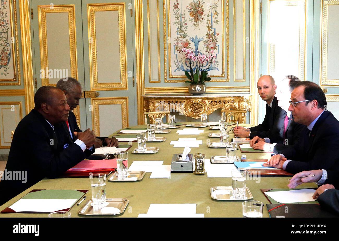 President of Guinea Alpha Conde, left, meets with French president