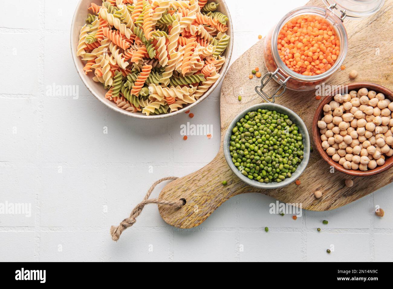 A variety of fusilli pasta made from different types of legumes, green and red lentils, mung beans and chickpeas. Gluten-free pasta. Stock Photo