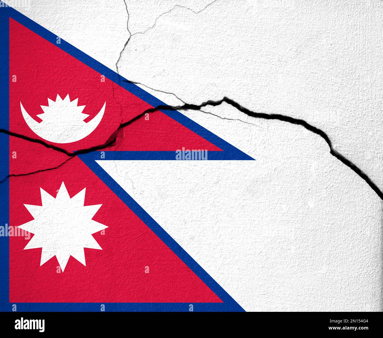 Earthquakes in Nepal, flag El Nepalon a wall with cracks from an
