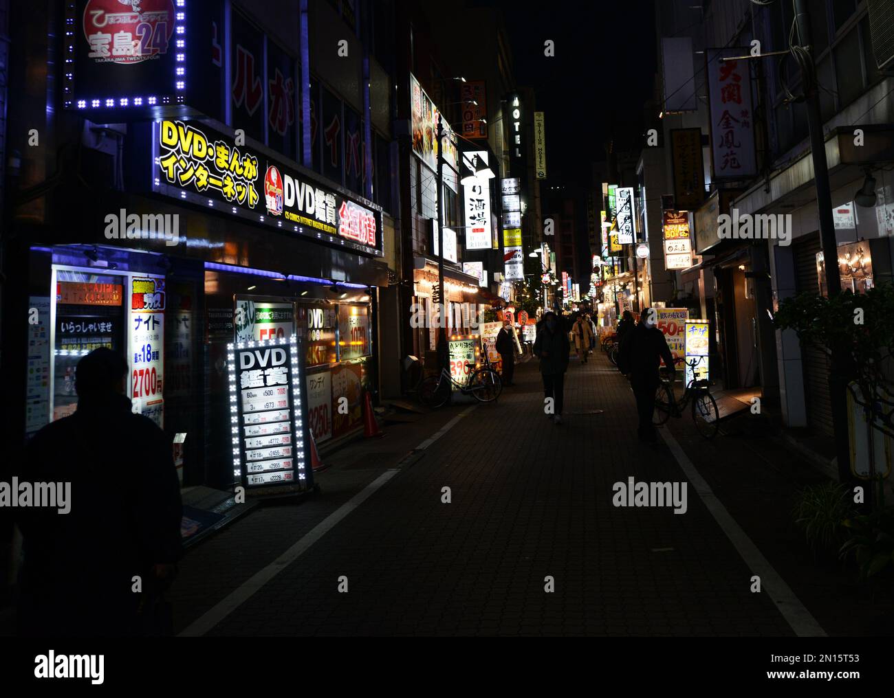 Walking between the bars, clubs and restaurants in the narrow streets of Ueno, Tokyo, Japan. Stock Photo