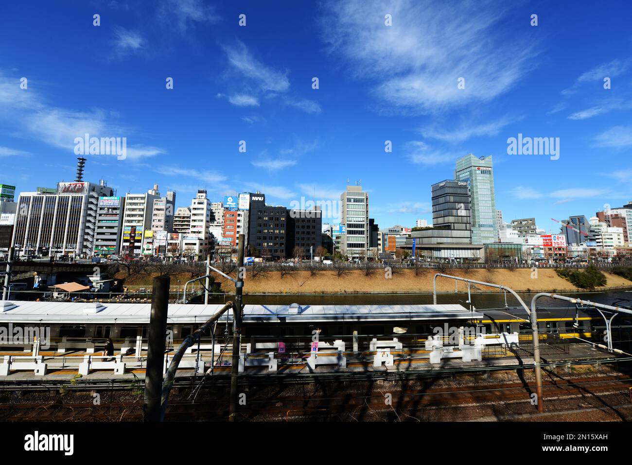 A view of the changing skyline in Ichigaya along the Imperial palace outer moat and the JR Chou line. Tokyo, Japan. Stock Photo