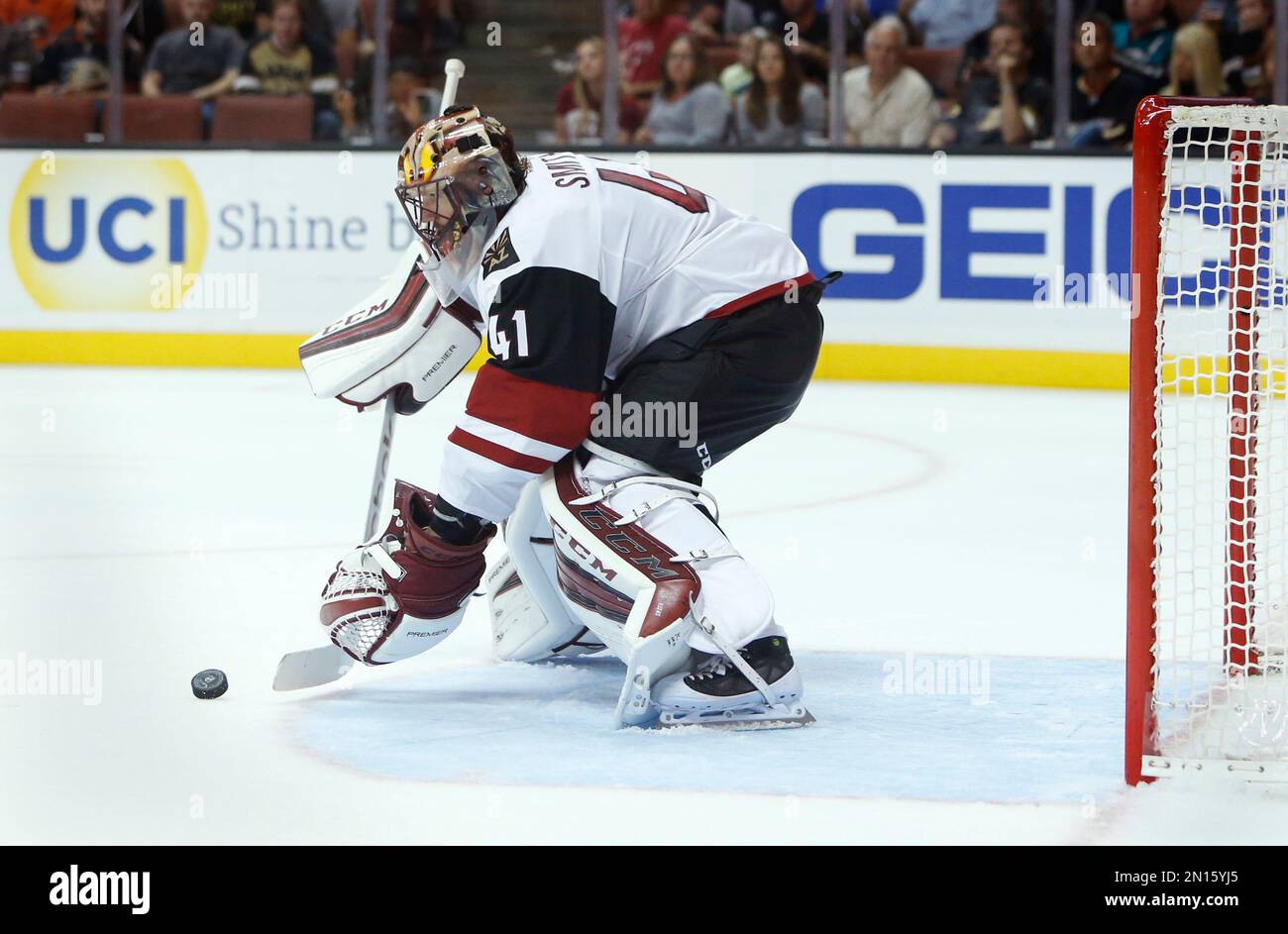 Arizona Coyotes goalie Mike Smith stops the puck in an NHL hockey game ...