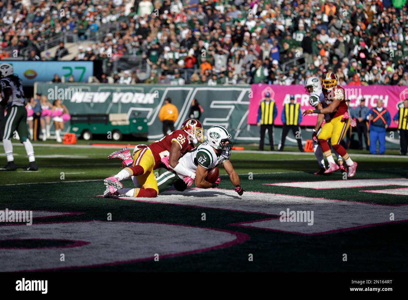 New York Jets wide receiver Eric Decker, right, scores on a touchdown