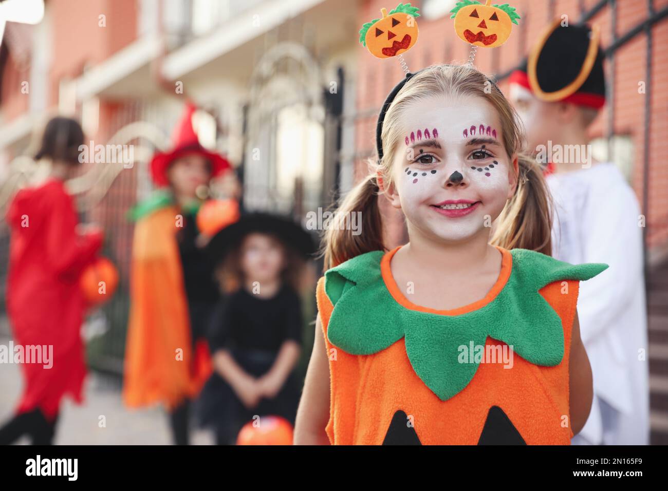 Cute little girl wearing Halloween costume outdoors Stock Photo - Alamy